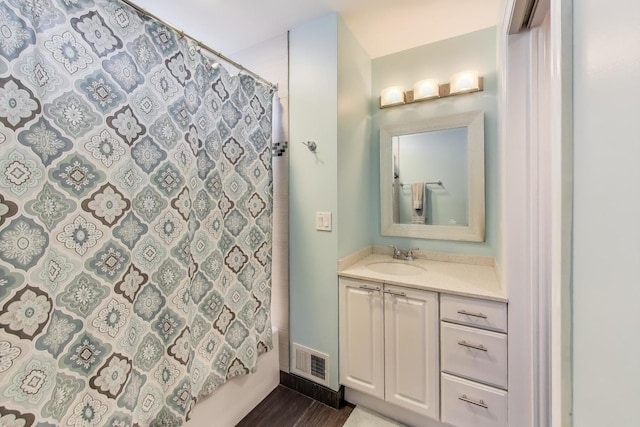 5921 N Navarre Ave, Chicago, IL 60631 - full bathroom featuring vanity, a shower with curtain, and wood finished floors