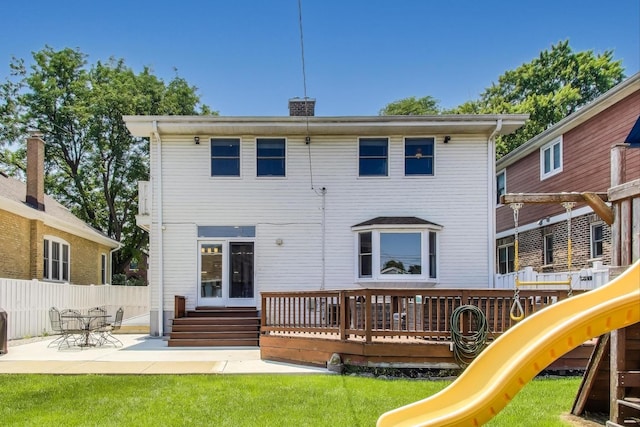 5921 N Navarre Ave, Chicago, IL 60631 - back of property with a playground, a chimney, and a patio area