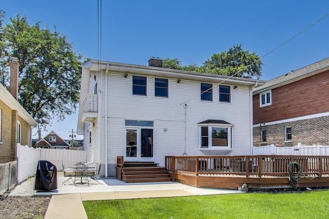 5921 N Navarre Ave, Chicago, IL 60631 - rear view of property with a chimney, a patio, and a wooden deck