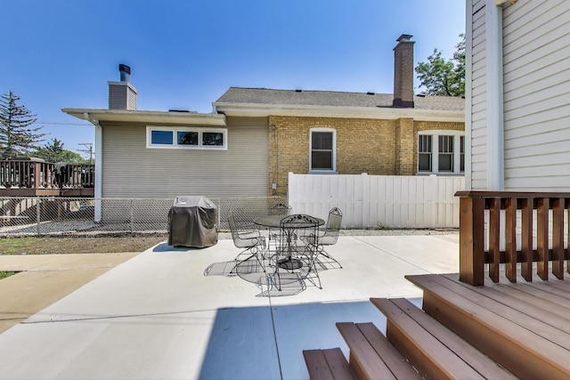 5921 N Navarre Ave, Chicago, IL 60631 - view of patio / terrace featuring grilling area, outdoor dining space, and a deck
