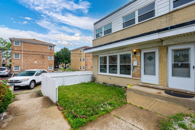 8821 N Washington St Unit F, Niles, IL 60714 - property entrance featuring brick siding