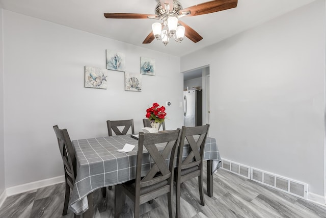 8821 N Washington St Unit F, Niles, IL 60714 - dining room with ceiling fan and wood finished floors