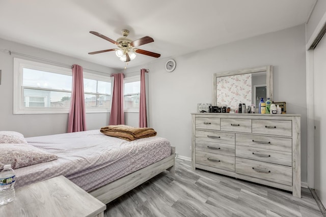 8821 N Washington St Unit F, Niles, IL 60714 - bedroom with a ceiling fan and baseboards