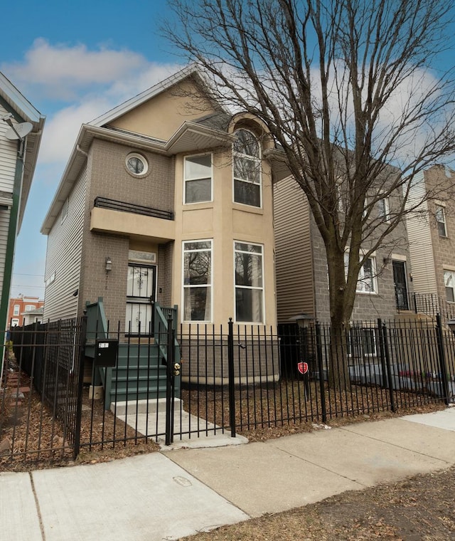 2718 W Washington Blvd, Chicago, IL 60612 - view of front facade featuring brick siding and a fenced front yard
