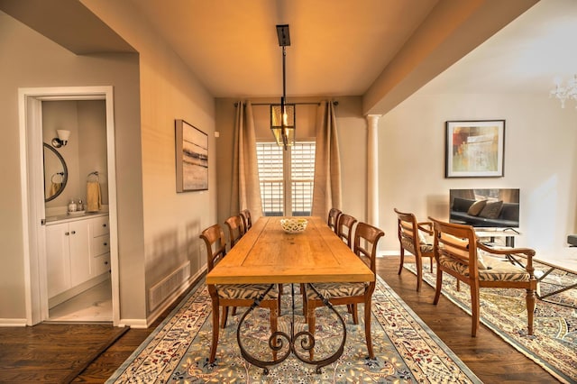 2718 W Washington Blvd, Chicago, IL 60612 - dining room with a chandelier and dark wood-type flooring