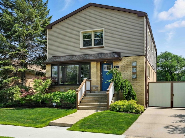 7515 W Roscoe St, Chicago, IL 60634 - view of front of property featuring brick siding, a front yard, a shingled roof, and a gate