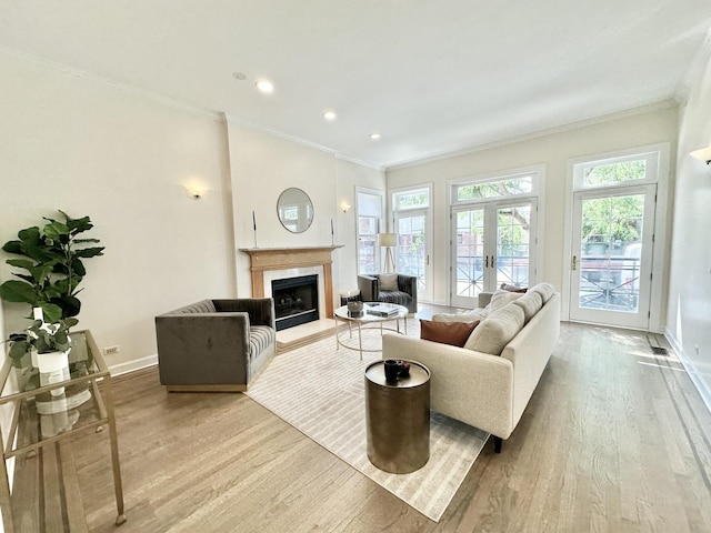 1617 N Hermitage Ave Unit 1S, Chicago, IL 60622 - living room with ornamental molding, wood finished floors, a premium fireplace, french doors, and recessed lighting