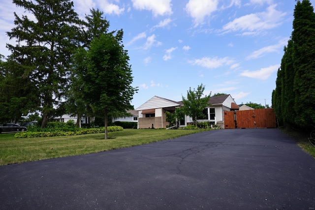 2304 Jay Ln, Rolling Meadows, IL 60008 - view of front facade with driveway, a gate, and a front yard