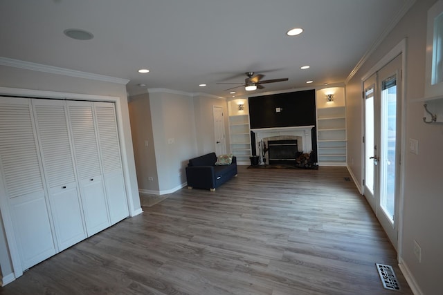 2304 Jay Ln, Rolling Meadows, IL 60008 - unfurnished living room with a ceiling fan, healthy amount of natural light, ornamental molding, recessed lighting, and wood finished floors