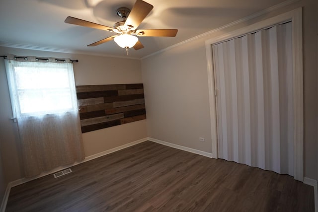 2304 Jay Ln, Rolling Meadows, IL 60008 - spare room featuring dark wood finished floors, a ceiling fan, and crown molding