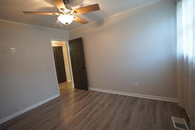 2304 Jay Ln, Rolling Meadows, IL 60008 - spare room featuring dark wood finished floors, a ceiling fan, and crown molding
