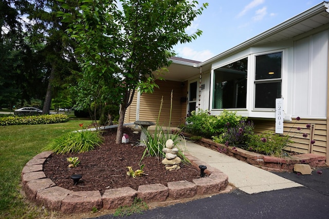 2304 Jay Ln, Rolling Meadows, IL 60008 - doorway to property featuring a lawn and board and batten siding