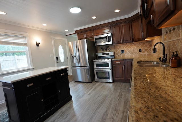 2304 Jay Ln, Rolling Meadows, IL 60008 - kitchen with stainless steel appliances, ornamental molding, tasteful backsplash, light wood-type flooring, and light stone countertops