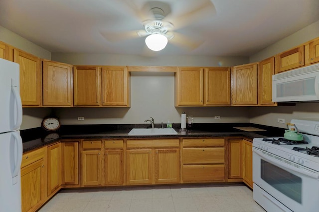807 Harris Ln Unit 807, Romeoville, IL 60446 - kitchen featuring white appliances, ceiling fan, dark countertops, and light flooring