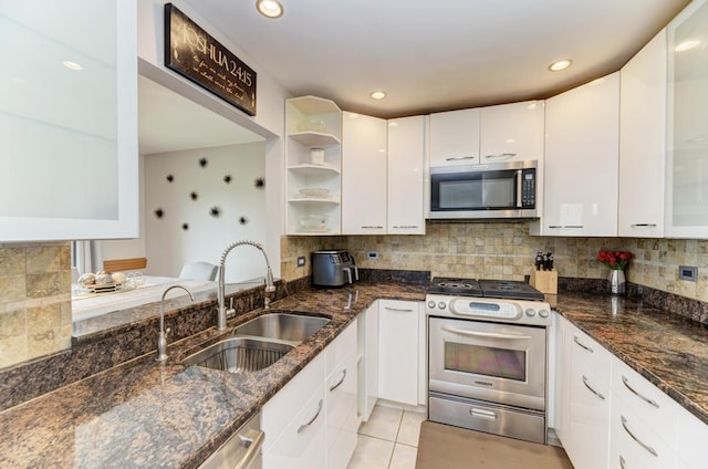 807 Harris Ln Unit 807, Romeoville, IL 60446 - kitchen featuring appliances with stainless steel finishes, white cabinetry, tasteful backsplash, open shelves, and dark stone counters