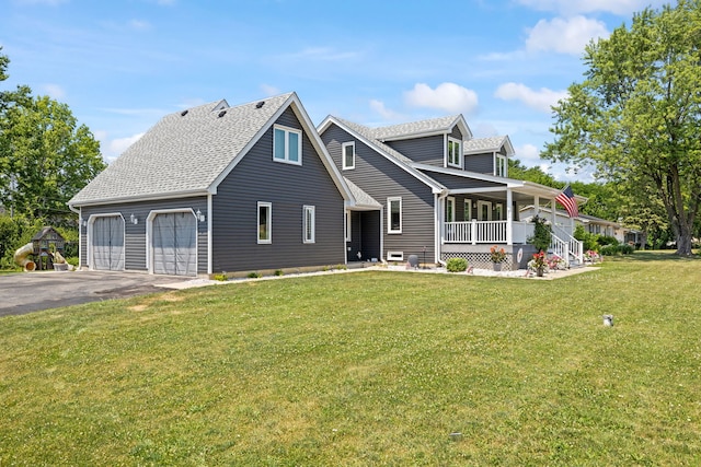 12351 W Warren Dr, Mokena, IL 60448 - view of front facade with covered porch, asphalt driveway, a front yard, an attached garage, and roof with shingles