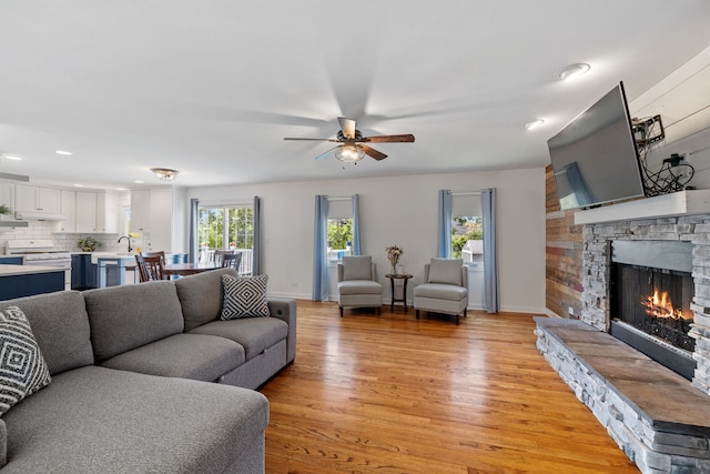12351 W Warren Dr, Mokena, IL 60448 - living room featuring light wood-style floors, a ceiling fan, recessed lighting, and a fireplace