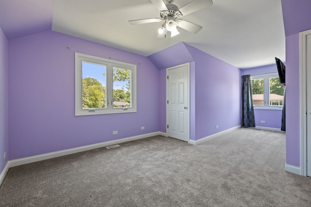 12351 W Warren Dr, Mokena, IL 60448 - unfurnished bedroom with vaulted ceiling, carpet, and ceiling fan