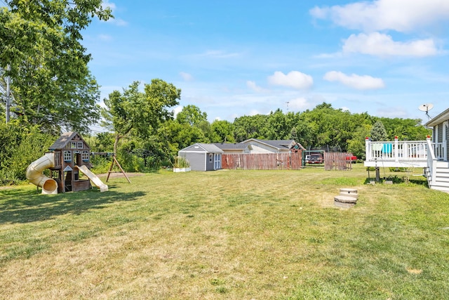 12351 W Warren Dr, Mokena, IL 60448 - view of yard with a playground, a shed, a deck, and view of scattered trees