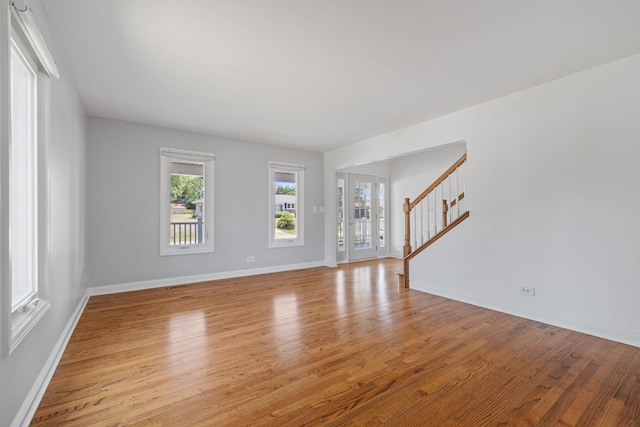 12351 W Warren Dr, Mokena, IL 60448 - unfurnished living room with stairs and light wood finished floors