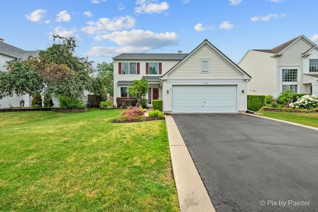 534 Ivory Ln, Bartlett, IL 60103 - traditional-style house featuring driveway, a front lawn, and an attached garage