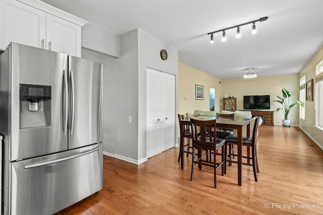 534 Ivory Ln, Bartlett, IL 60103 - dining area with light wood-type flooring and rail lighting
