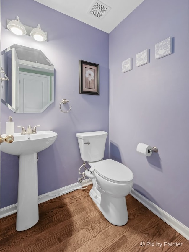 534 Ivory Ln, Bartlett, IL 60103 - half bathroom featuring baseboards and wood finished floors