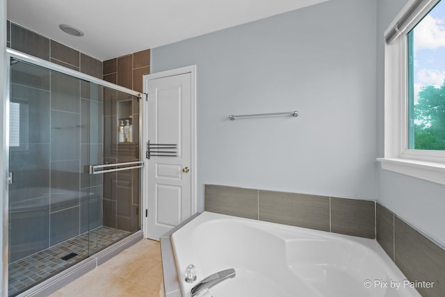 534 Ivory Ln, Bartlett, IL 60103 - bathroom with a bath, a stall shower, and tile patterned flooring