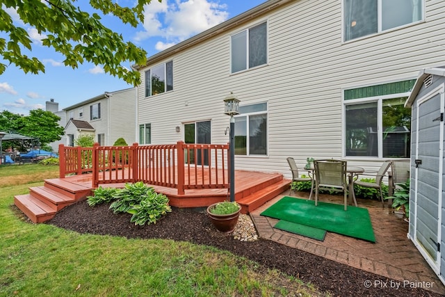 534 Ivory Ln, Bartlett, IL 60103 - back of house with a lawn, a deck, and outdoor dining area