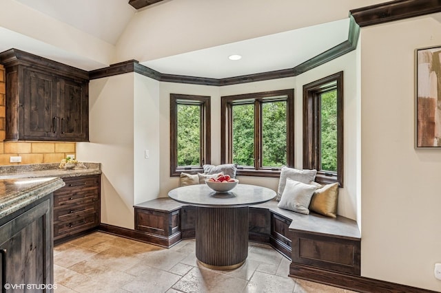 1899 Hilltop Ln, Bannockburn, IL 60015 - dining room featuring breakfast area, stone tile floors, lofted ceiling, and recessed lighting