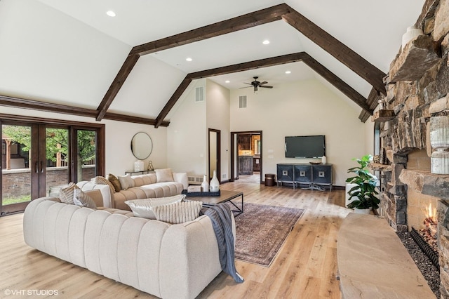 1899 Hilltop Ln, Bannockburn, IL 60015 - living area featuring a large fireplace, high vaulted ceiling, beamed ceiling, ceiling fan, and light wood-type flooring