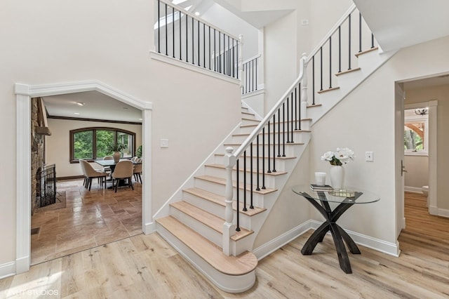1899 Hilltop Ln, Bannockburn, IL 60015 - stairs featuring a towering ceiling and wood finished floors