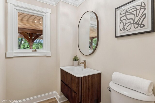 1899 Hilltop Ln, Bannockburn, IL 60015 - half bathroom featuring vanity and ornamental molding