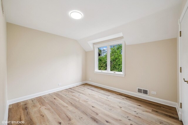 1899 Hilltop Ln, Bannockburn, IL 60015 - additional living space featuring wood finished floors and vaulted ceiling