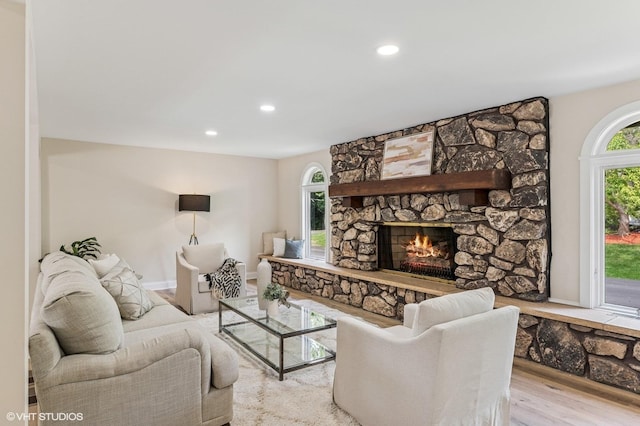 1899 Hilltop Ln, Bannockburn, IL 60015 - living area with a stone fireplace, wood finished floors, and recessed lighting
