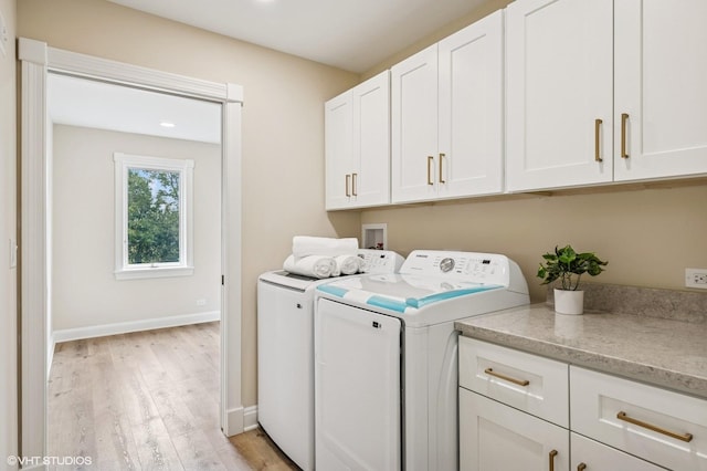 1899 Hilltop Ln, Bannockburn, IL 60015 - laundry area featuring cabinet space, light wood finished floors, and washer and dryer