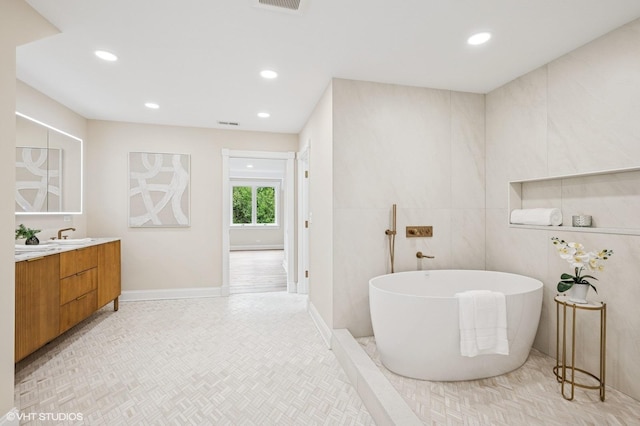 1899 Hilltop Ln, Bannockburn, IL 60015 - bathroom featuring a freestanding bath, vanity, and recessed lighting