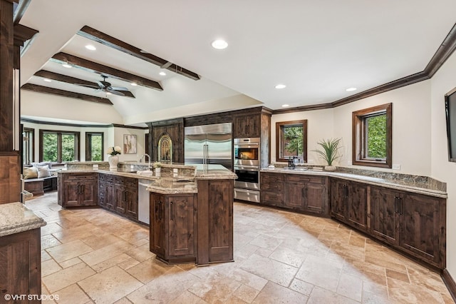 1899 Hilltop Ln, Bannockburn, IL 60015 - kitchen featuring a warming drawer, plenty of natural light, stone tile floors, stainless steel appliances, and recessed lighting