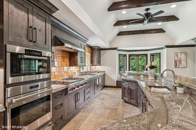 1899 Hilltop Ln, Bannockburn, IL 60015 - kitchen featuring stainless steel appliances, stone tile floors, decorative backsplash, light stone countertops, and ventilation hood