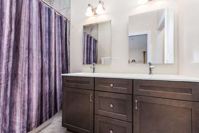 15710 S Cove Cir, Plainfield, IL 60544 - bathroom with double vanity, marble look tiles, and a shower with shower curtain