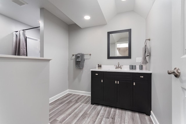 15710 S Cove Cir, Plainfield, IL 60544 - bathroom featuring vanity, wood finished floors, a shower with shower curtain, lofted ceiling, and recessed lighting