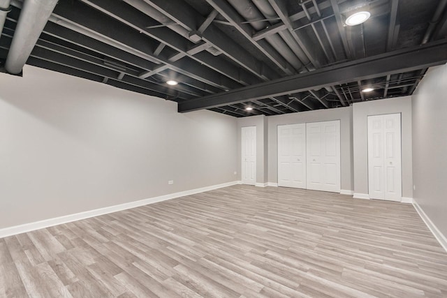 15710 S Cove Cir, Plainfield, IL 60544 - finished below grade area with light wood finished floors and baseboards