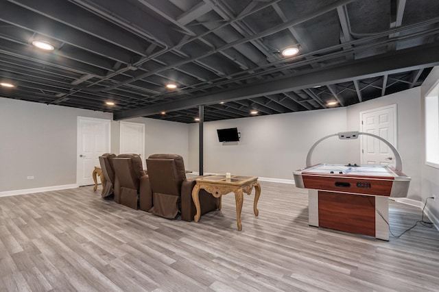 15710 S Cove Cir, Plainfield, IL 60544 - home theater with light wood-style flooring and baseboards