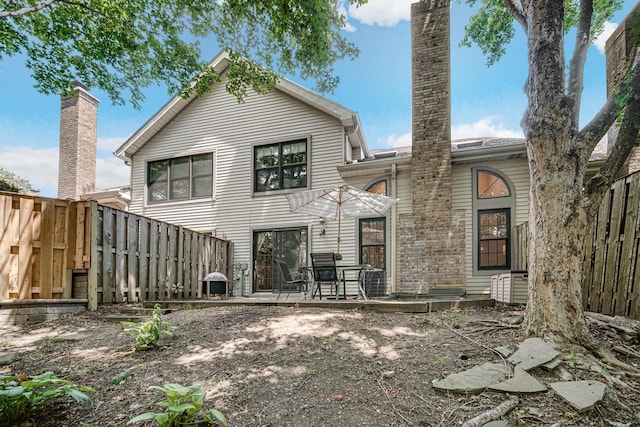 826 N Auburn Woods Dr, Palatine, IL 60067 - rear view of property featuring a fenced backyard and a patio