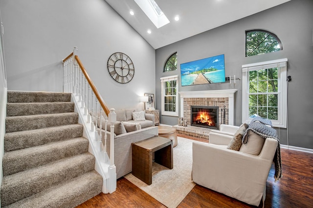 826 N Auburn Woods Dr, Palatine, IL 60067 - living area with high vaulted ceiling, a skylight, wood finished floors, recessed lighting, and a fireplace
