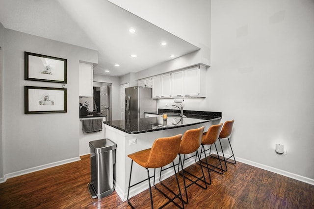826 N Auburn Woods Dr, Palatine, IL 60067 - kitchen with stainless steel fridge with ice dispenser, a peninsula, dark wood finished floors, recessed lighting, and white cabinetry