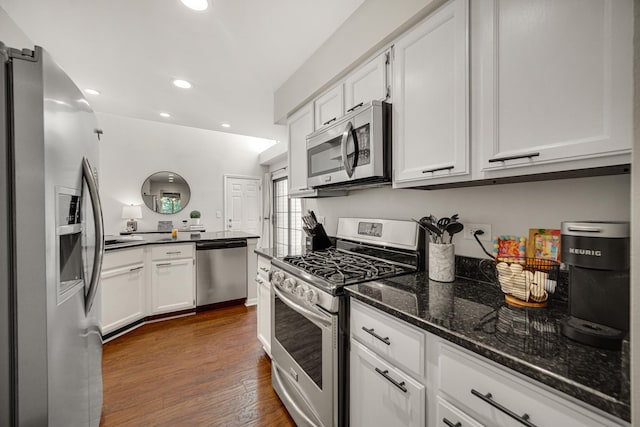 826 N Auburn Woods Dr, Palatine, IL 60067 - kitchen with appliances with stainless steel finishes, white cabinetry, recessed lighting, dark stone counters, and dark wood finished floors