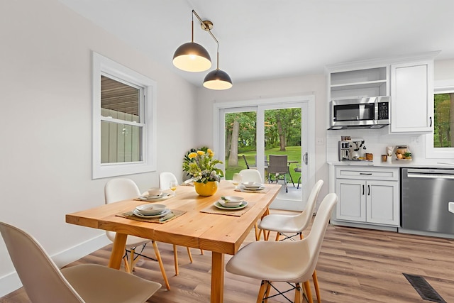 6427 Harlem Rd, Loves Park, IL 61111 - dining area featuring light wood finished floors