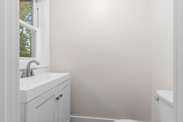 6427 Harlem Rd, Loves Park, IL 61111 - bathroom featuring toilet and vanity