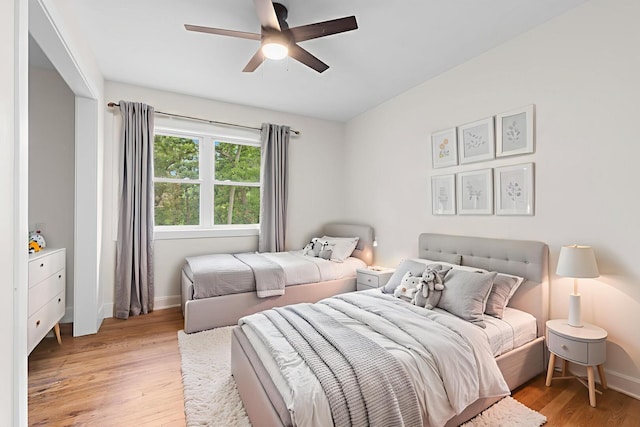 6427 Harlem Rd, Loves Park, IL 61111 - bedroom featuring light wood finished floors and ceiling fan